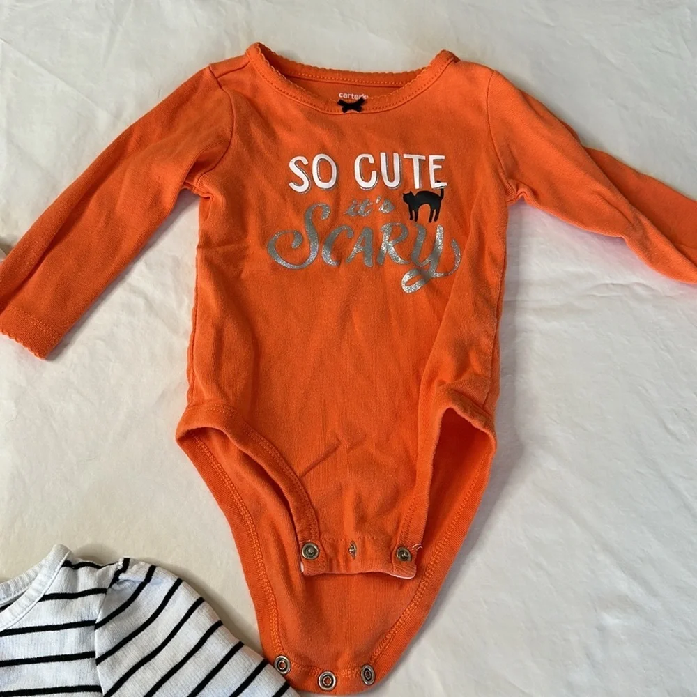 Bundle of my first Halloween clothes. Two long sleeve onesies and a tutu shirt.